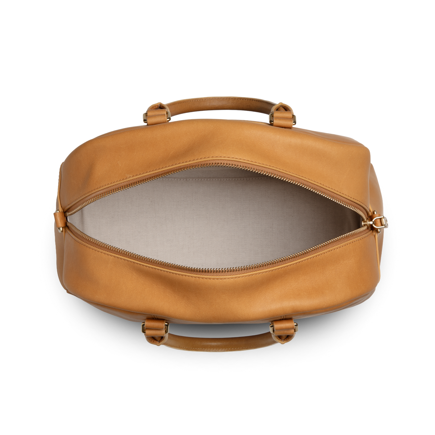 Top view of the Shinola Runwell Satchel - Honey, crafted from premium natural leather with beige fabric lining, displaying its empty interior and zipper closure.