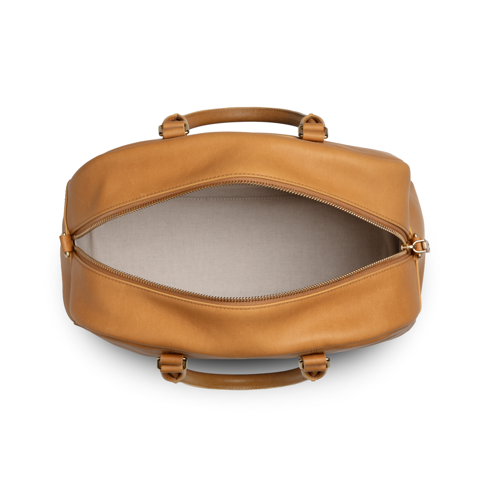 Top view of the Shinola Runwell Satchel - Honey, crafted from premium natural leather with beige fabric lining, displaying its empty interior and zipper closure.