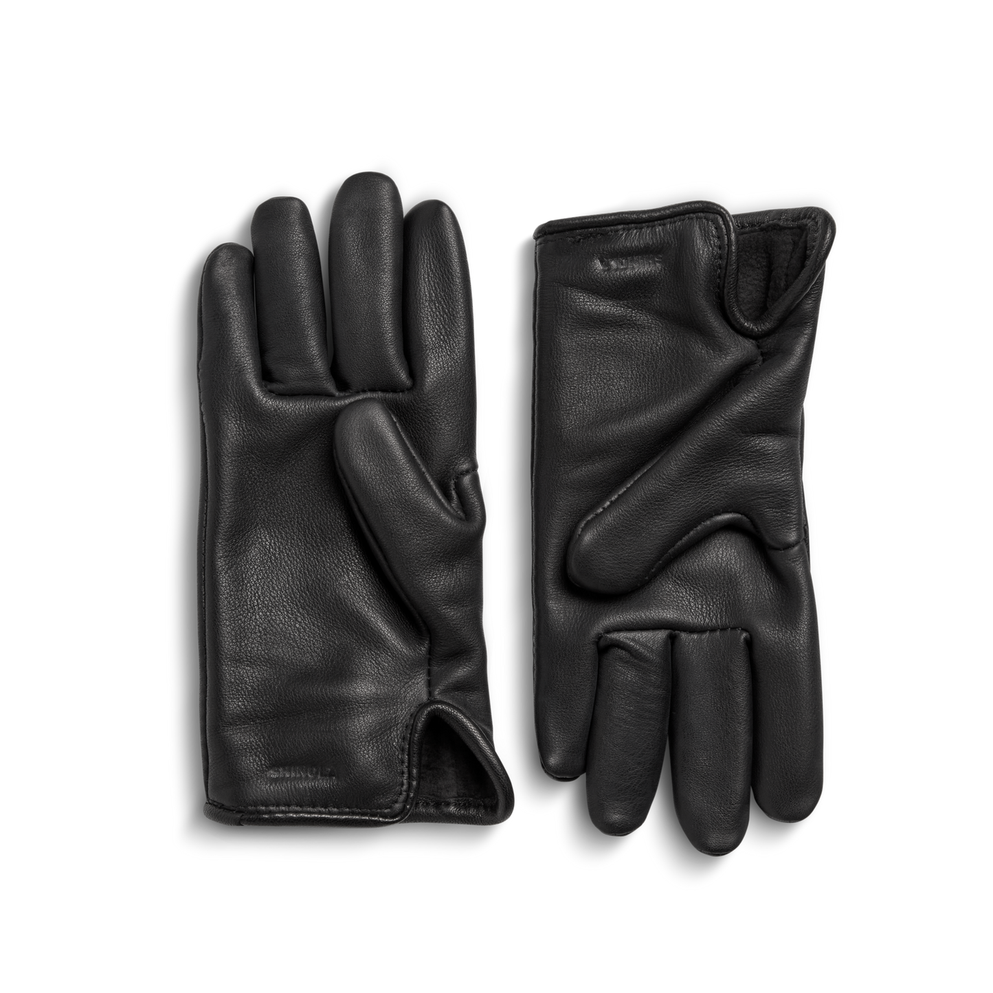 A pair of Shinola Lined Leather Gloves - Black, crafted from premium leather, are shown fleece-lined with one palm-up and the other palm-down on a light gray background.