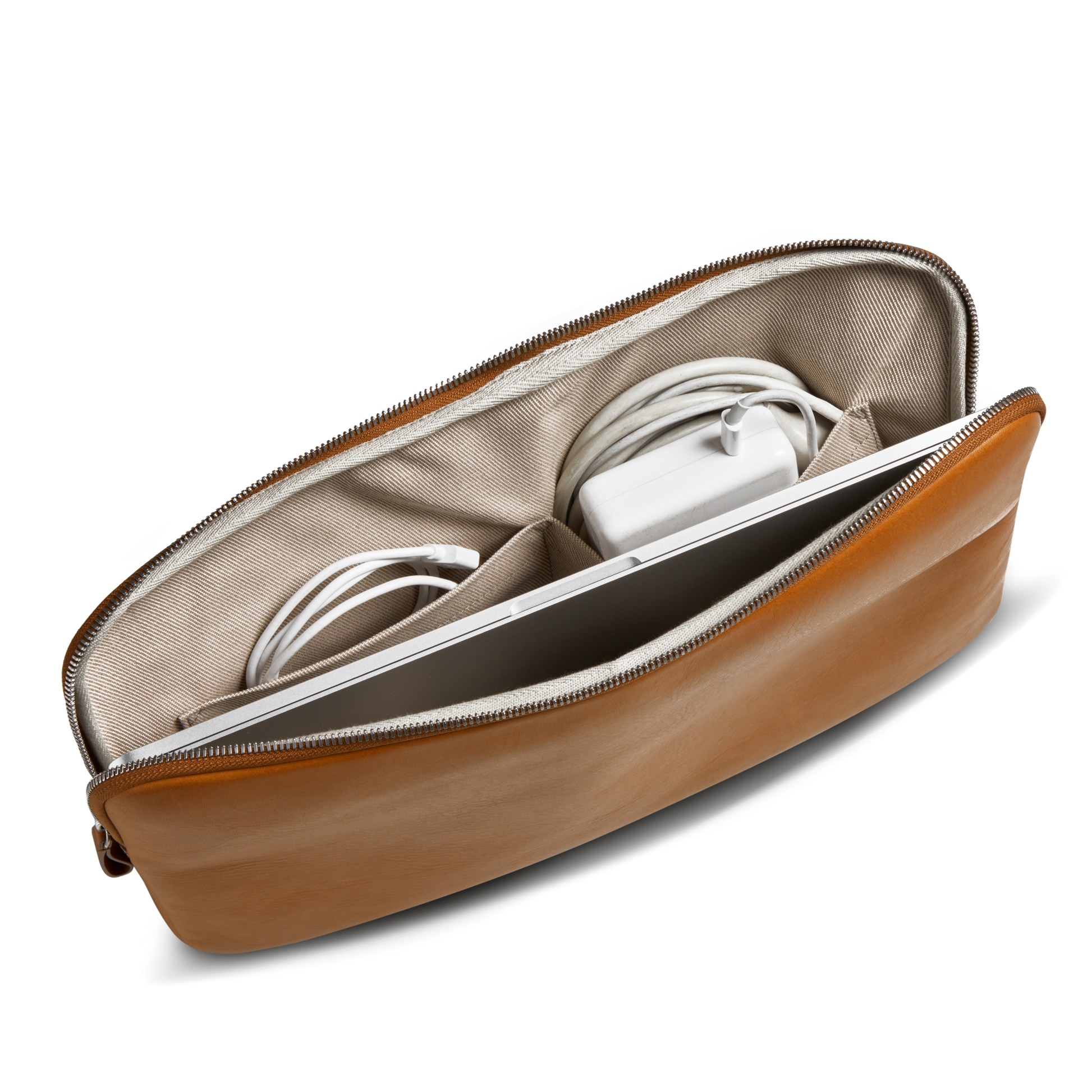 The Shinola Laptop Tech Case - Tan is a leather zippered pouch with a beige fabric interior, featuring separate compartments to organize your laptop, charger, and cables in style.