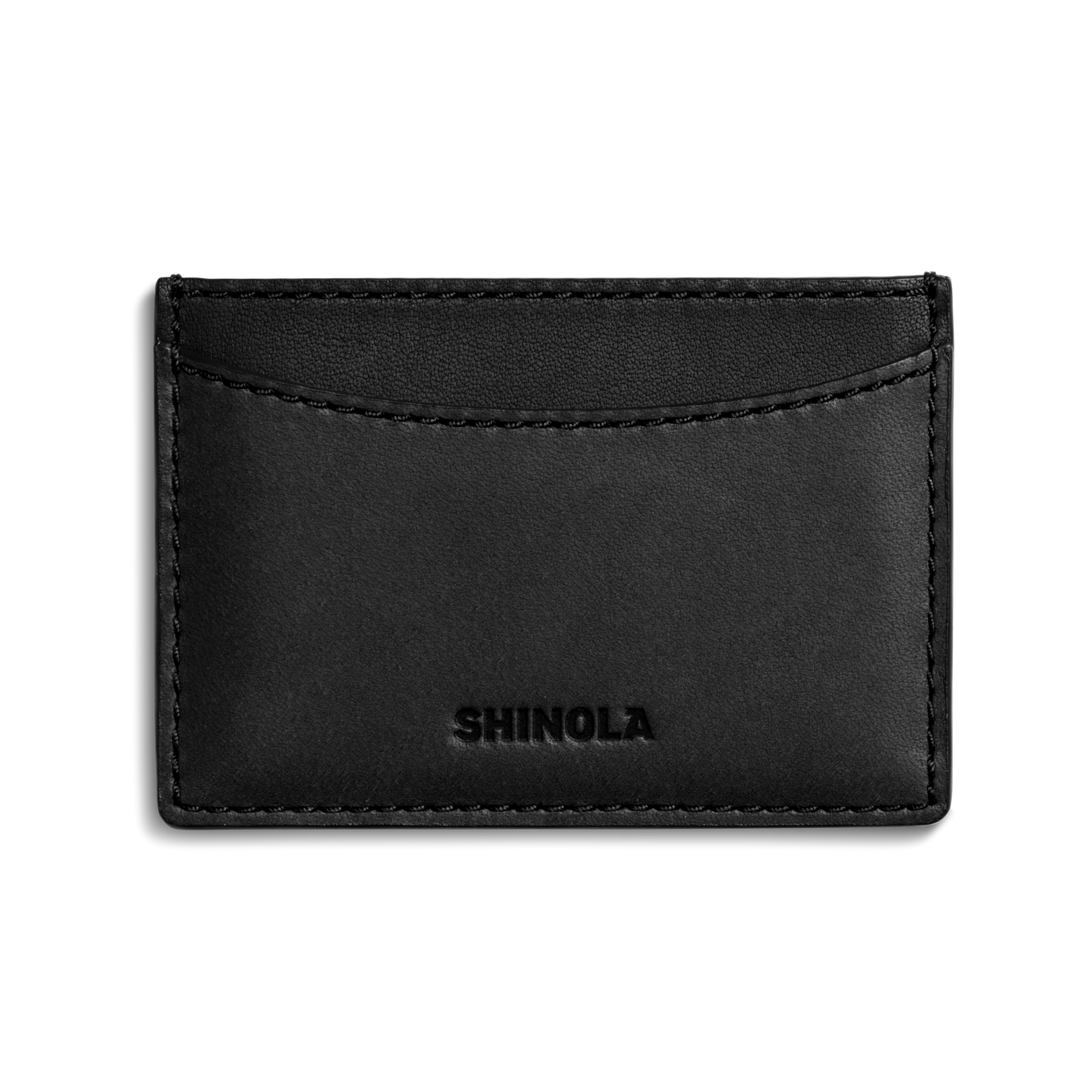 The Shinola Leather 3 Pocket Card Case in black features visible stitching, SHINOLA embossed on the front, and three curved pockets for sleek card organization.