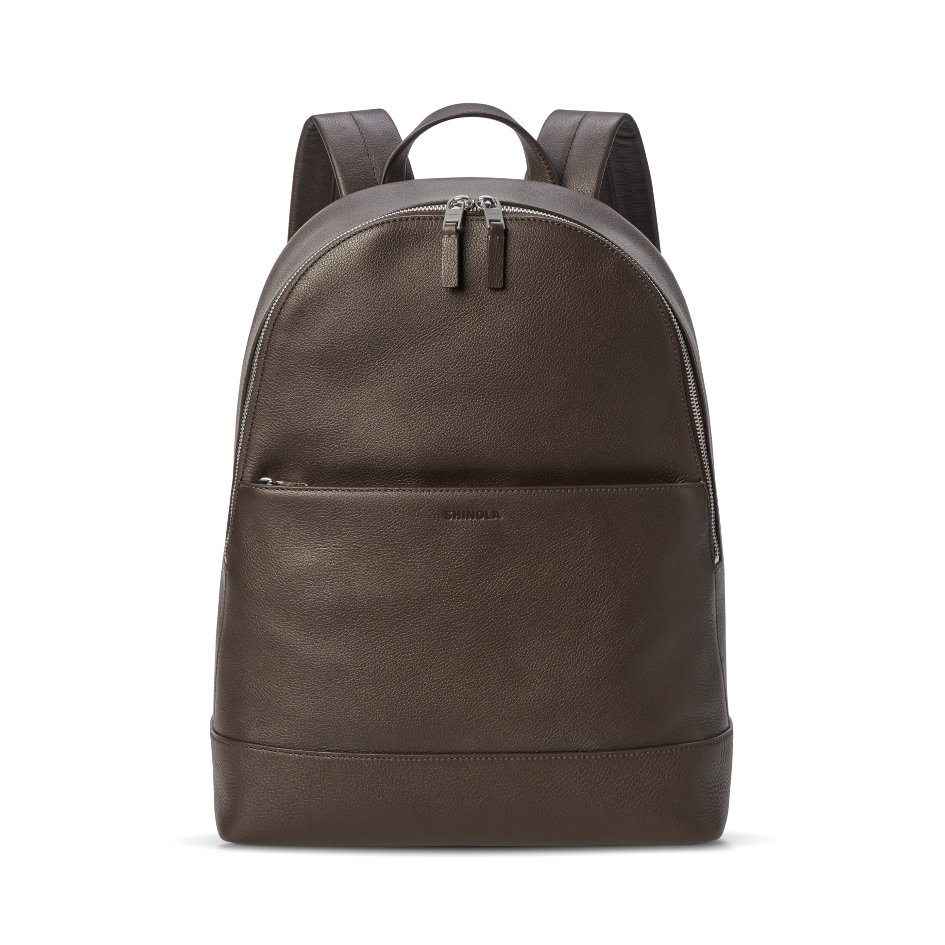 The Shinola Canfield Backpack - Espresso features a front zip pocket, double zipper top closure, and padded shoulder straps. This stylish brown leather laptop backpack is ideal for commuters and shown against a plain white background.