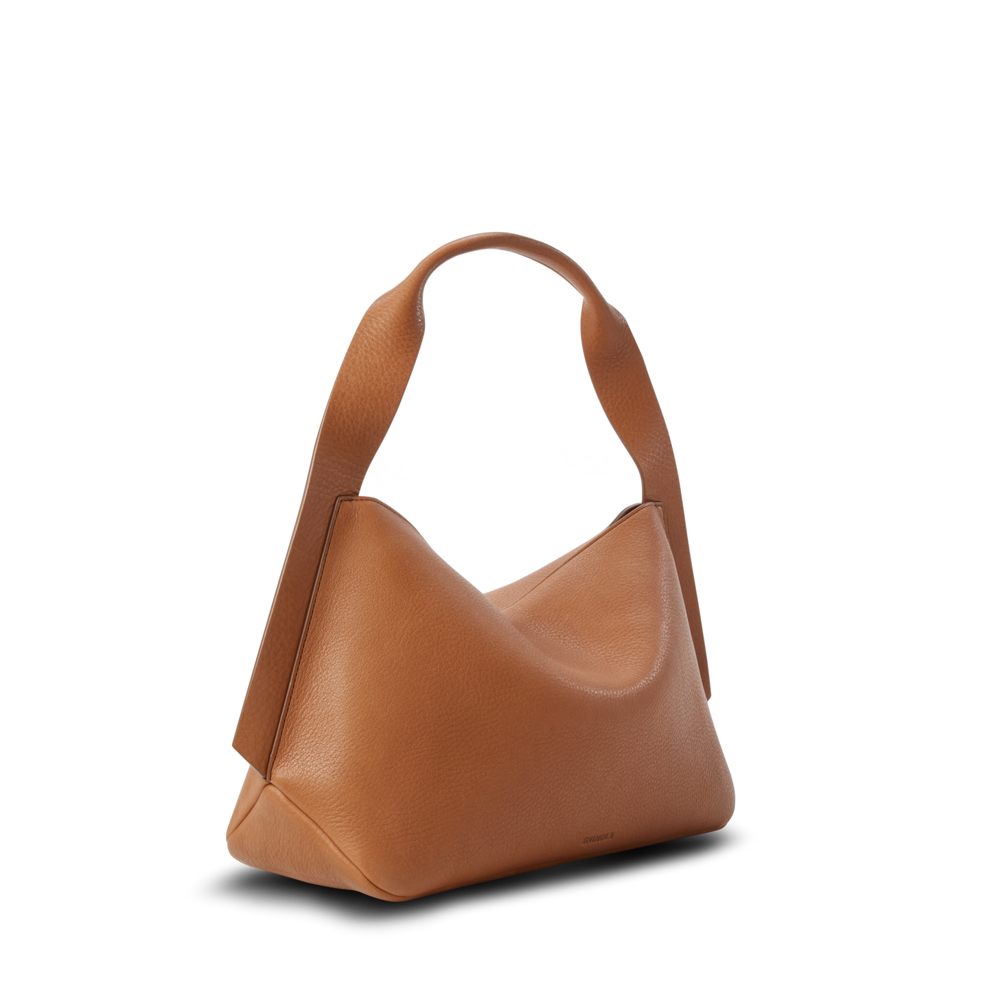 The Shinola Medium Derby Shoulder Bag in tan natural grain leather features a wide, curved handle and a soft, slouchy silhouette, shown against a plain white background.