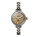 Assembled in Detroit, the Shinola Birdy Watch - Petoskey features a round vintage-style gold-tone face with gold numerals and a two-tone gold and stainless steel link band, shown on a plain white background.