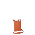 The Bixby Phone Crossbody - Rust by Shinola is a compact, rectangular bag in natural leather with a long strap and flap tab, featuring the Shinola logo embossed near the bottom.