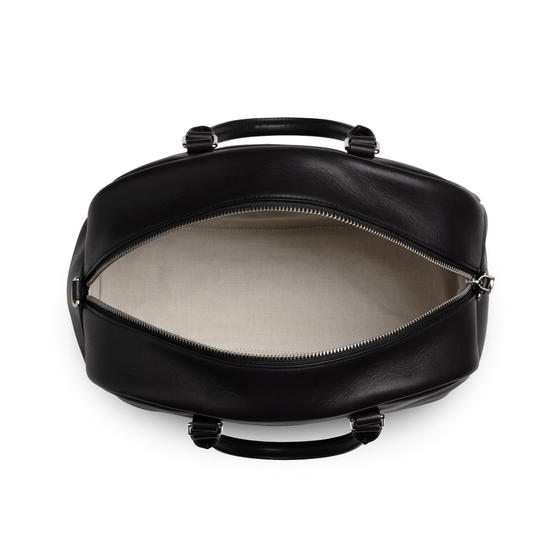 A top-down view displays the Shinola Runwell Satchel - Black shoulder bag with its zipper open, revealing a light-colored interior.