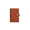 The Shinola Medium Snap Journal Cover in Rust is shown closed, featuring a strap and snap button closure, photographed against a plain white background.