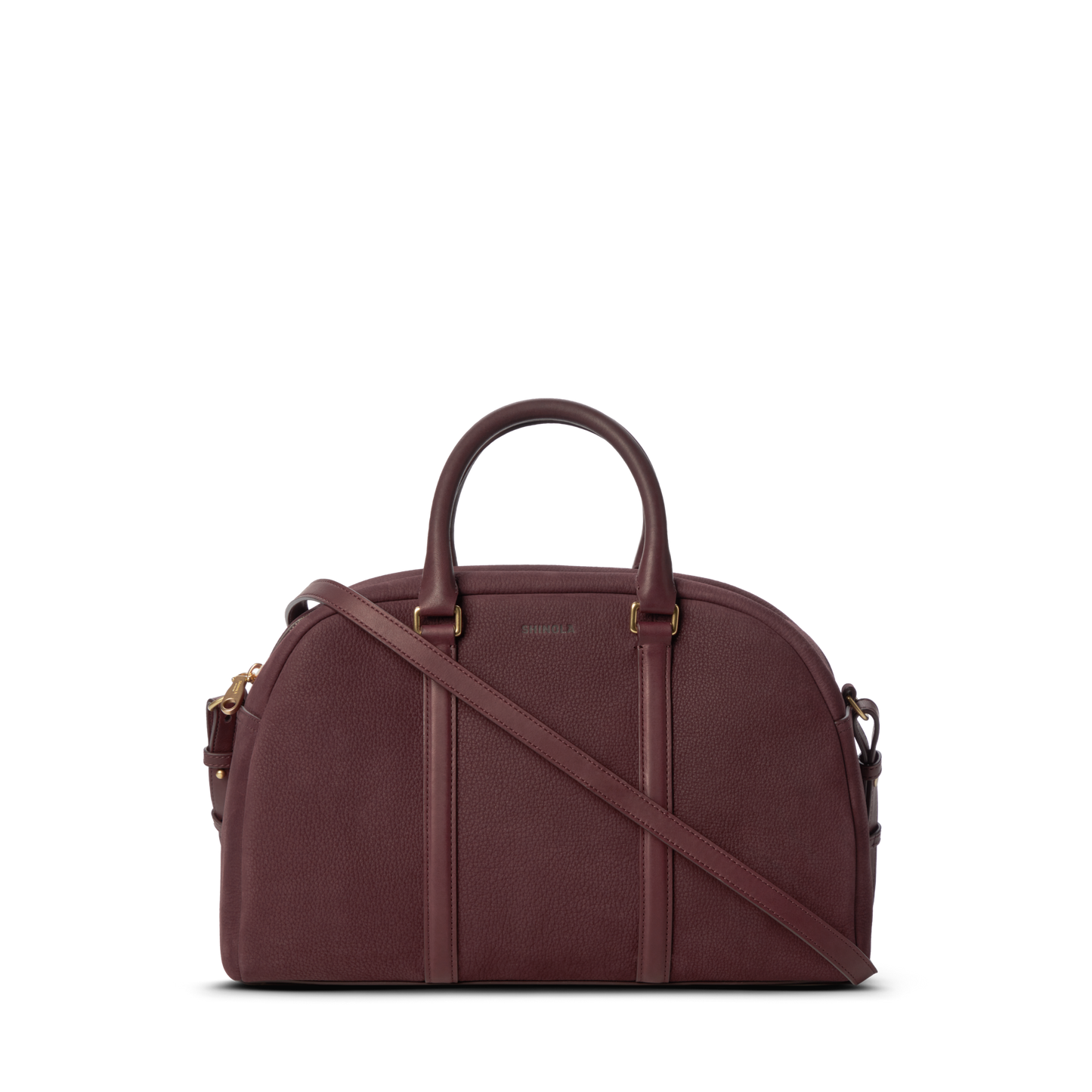 The Shinola Runwell Satchel - Merlot is a structured, dome-shaped women's crossbody with two handles, a detachable strap, gold-tone hardware, and subtle embossed branding on the front.
