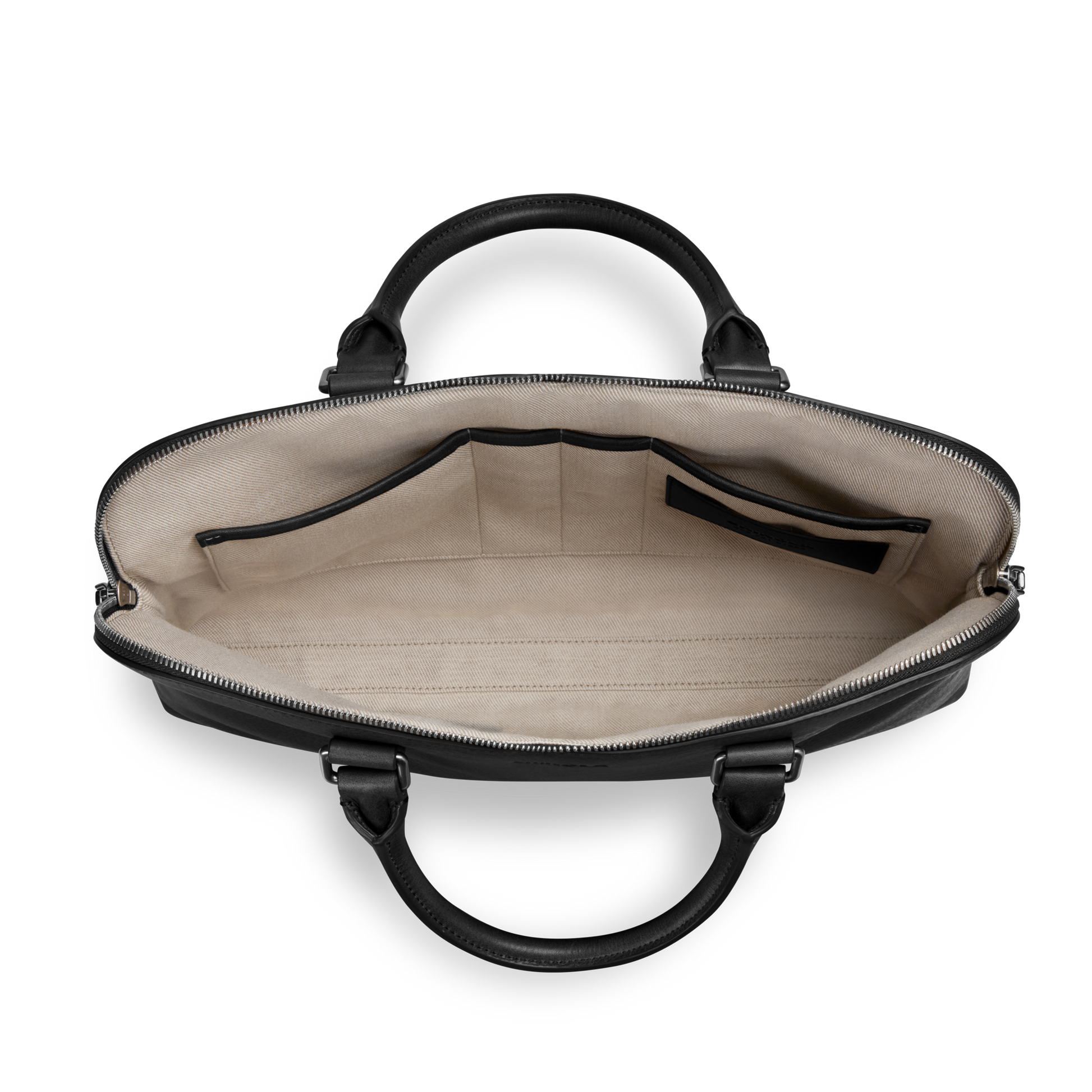 A top-down view of the Shinola Portfolio Briefcase in black European grain leather with beige lining, multiple interior pockets, two handles, and a zipper closure—perfect as a stylish leather brief.