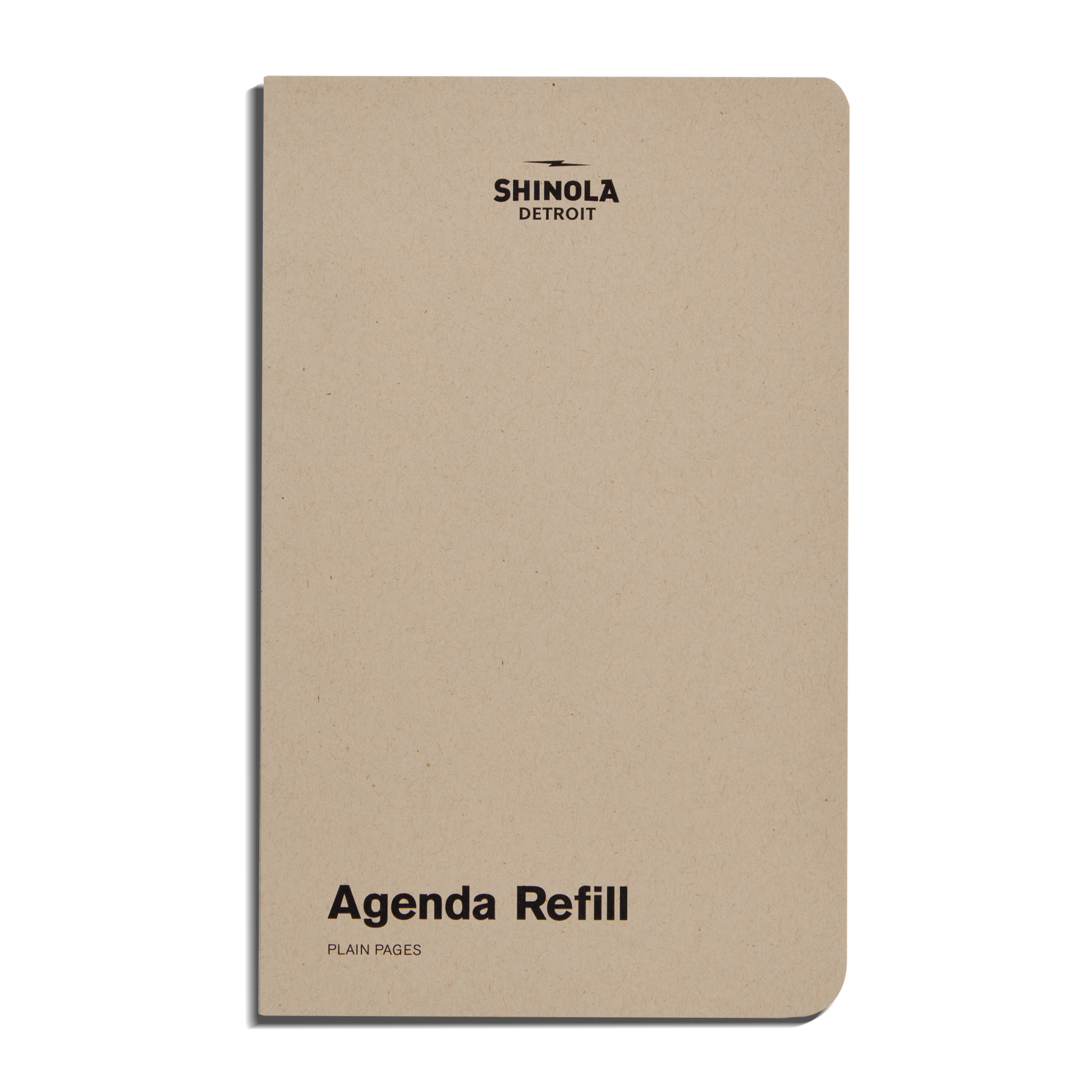 The Shinola Plain Agenda Insert - Kraft features a beige, plain cover with SHINOLA DETROIT at the top and “Agenda Refill, PLAIN INSERT PAGES” at the bottom right—ideal for your Refillable Leather Agenda. Edges are slightly rounded.