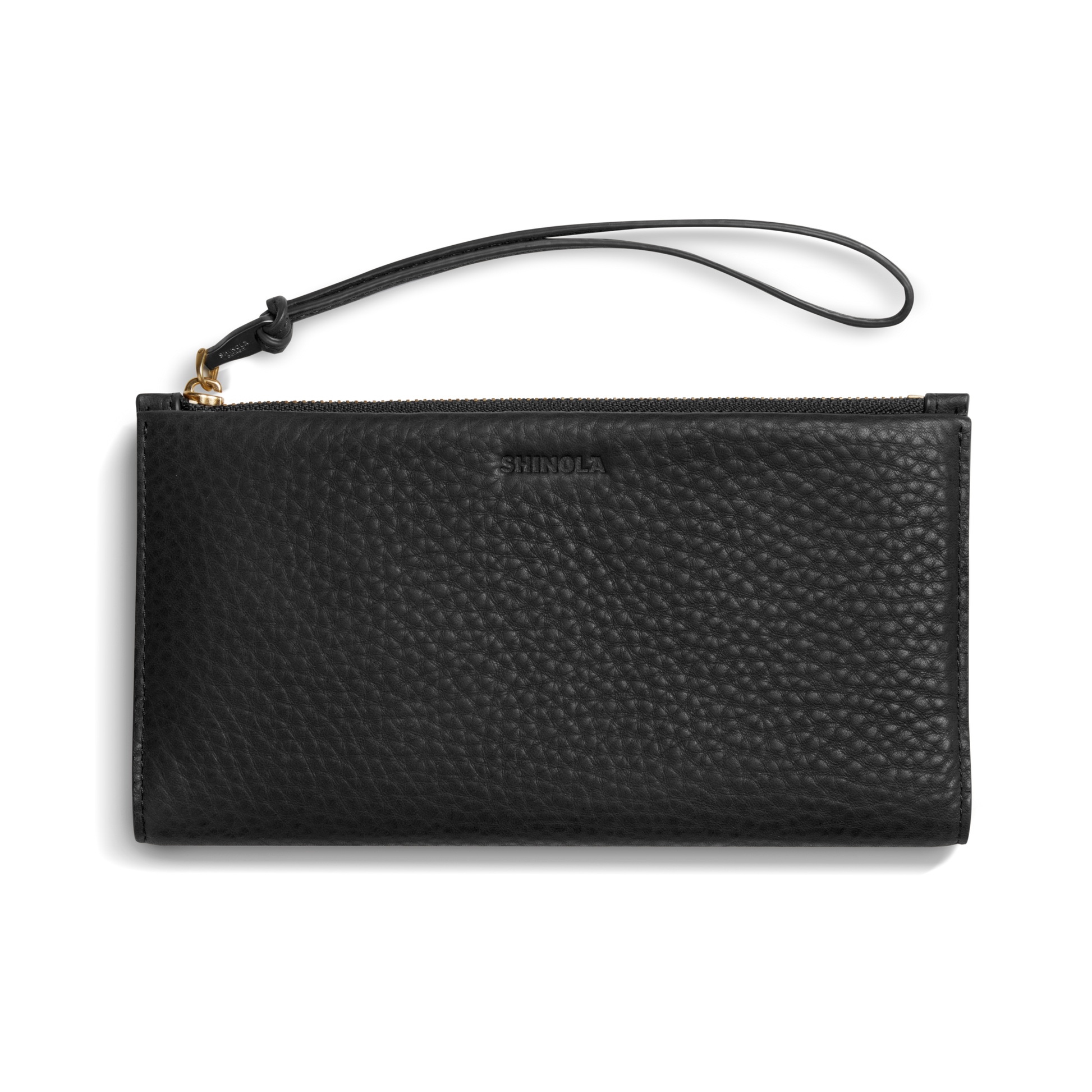 The Shinola Wristlet Wallet - Black features textured natural grain leather, card pockets, zipper closure, and a detachable wrist strap. "Shinola" is embossed on the front. Shown on a white background.