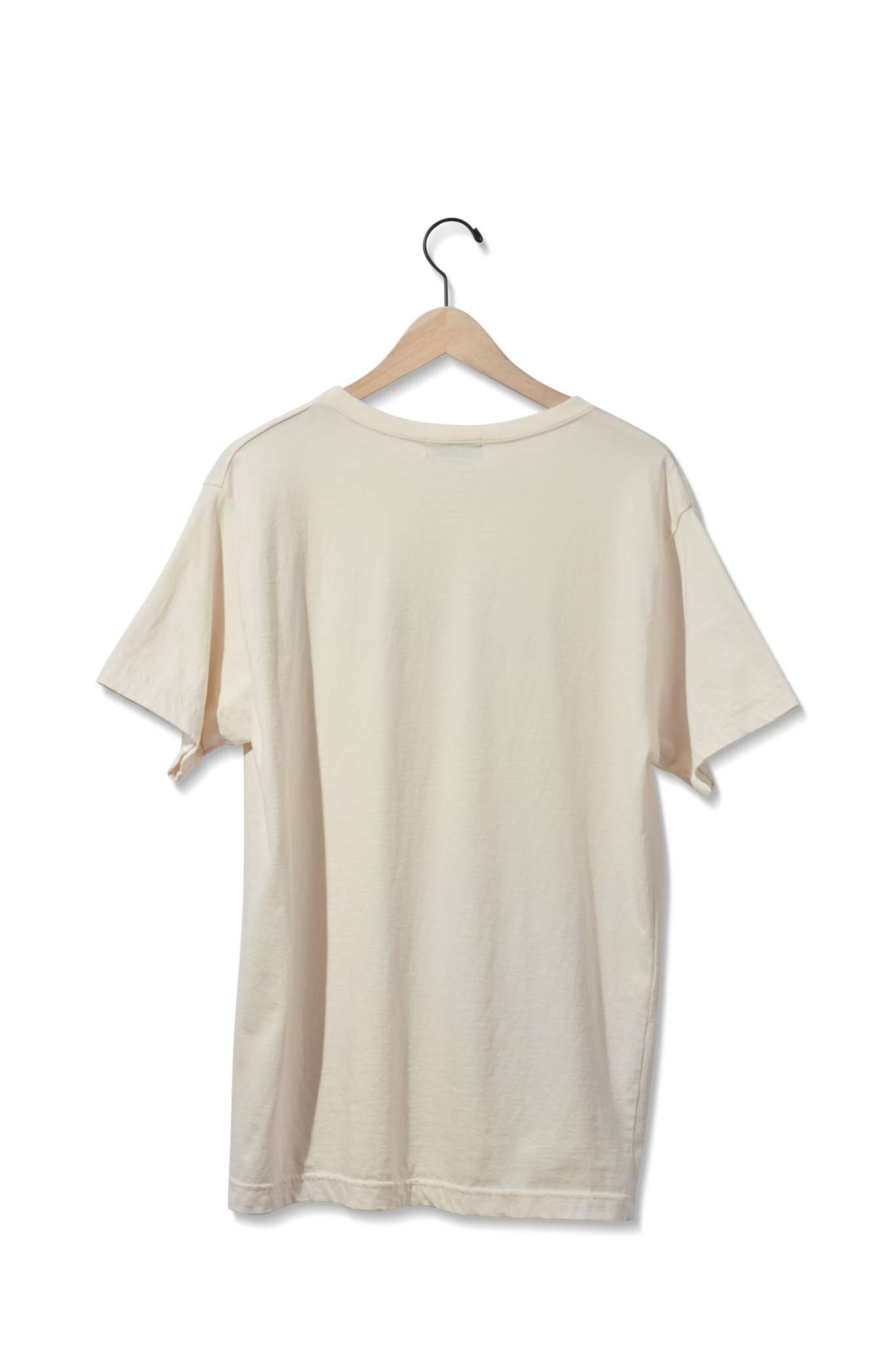 The Shinola Detroit Graphic T Shirt in cream, shown from the back, hangs on a wooden hanger against a white background.