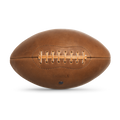 The Shinola Leather Football - British Tan features tan laces, visible stitching, and "Shinola" embossed on the surface. It is displayed against a plain white background.