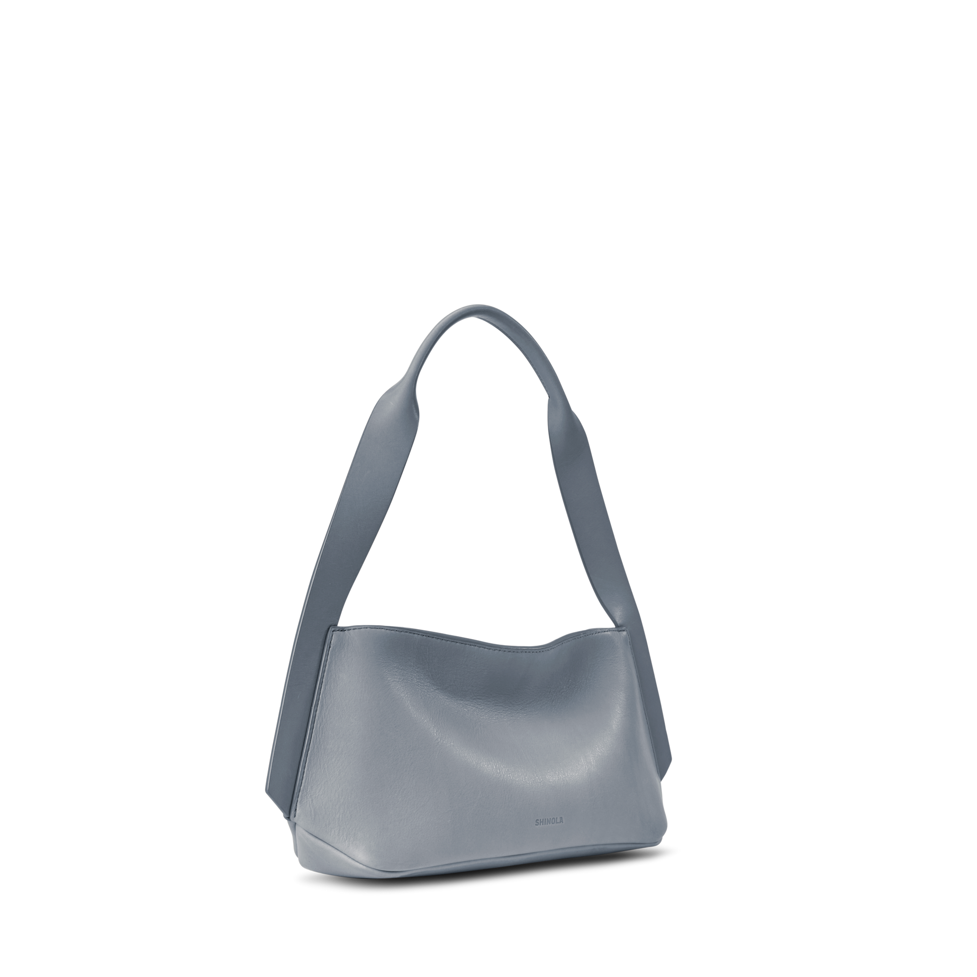 The Shinola Small Derby Shoulder Bag - Mist is a minimalist, light blue natural leather handbag with a wide shoulder strap, smooth texture, and modern design—perfect for day to night wear. Shown on a white background.