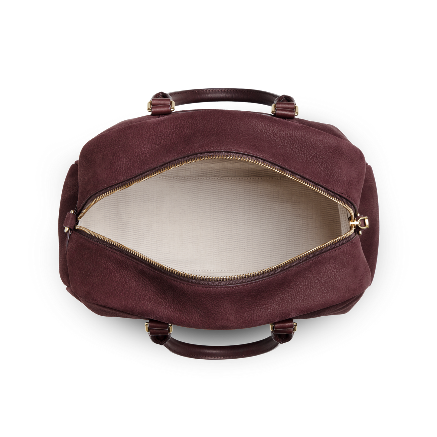 A top view of the Shinola Runwell Satchel - Merlot shows its spacious, empty interior, beige fabric lining, gold zipper, maroon Nubuck leather exterior, and two handles—a stylish alternative to a traditional women's crossbody bag.