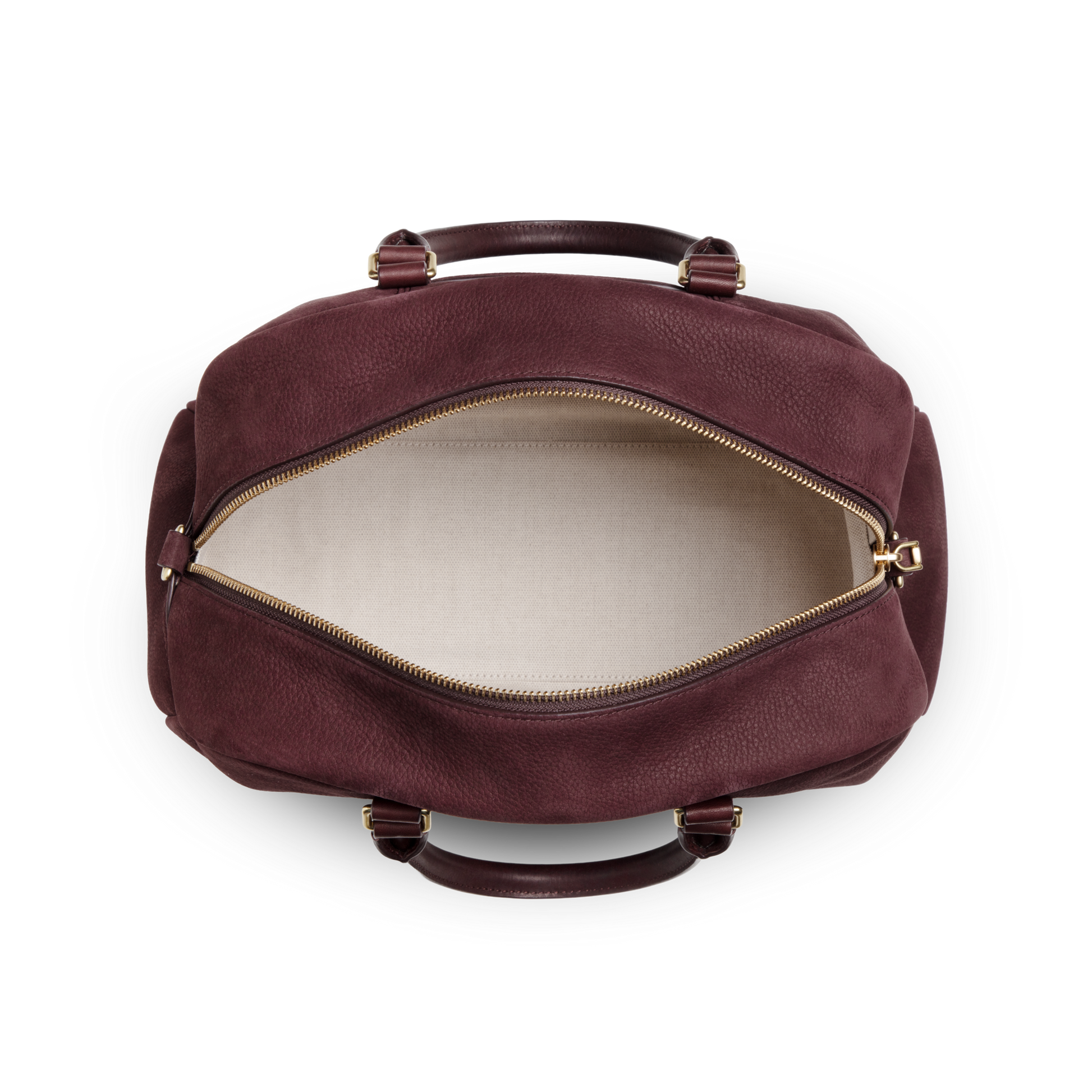 A top view of the Shinola Runwell Satchel - Merlot shows its spacious, empty interior, beige fabric lining, gold zipper, maroon Nubuck leather exterior, and two handles—a stylish alternative to a traditional women's crossbody bag.