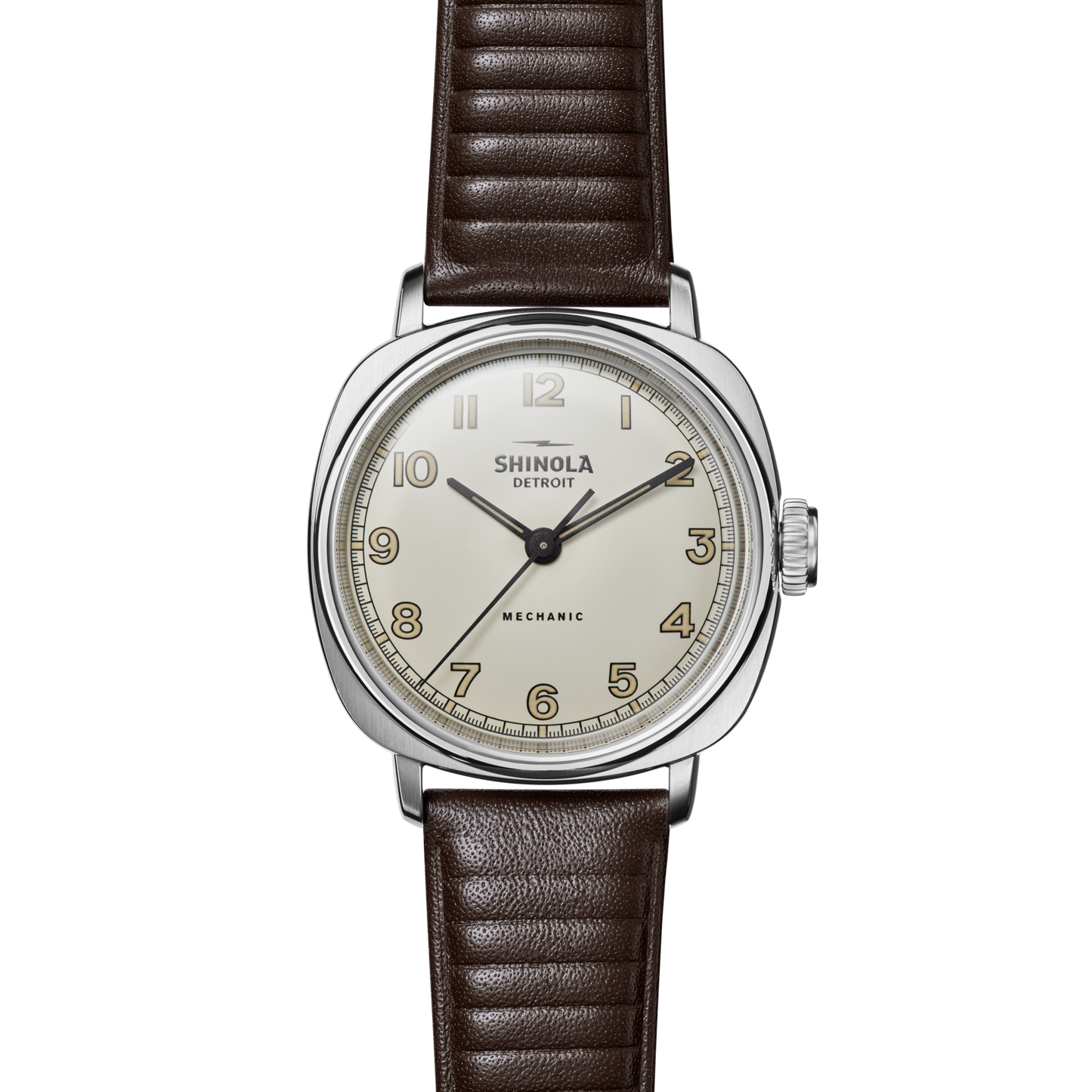 The Shinola Mechanic Watch - Alabaster features a round cream dial, gold Arabic numerals, silver case, and brown leather strap, displayed against a white background.