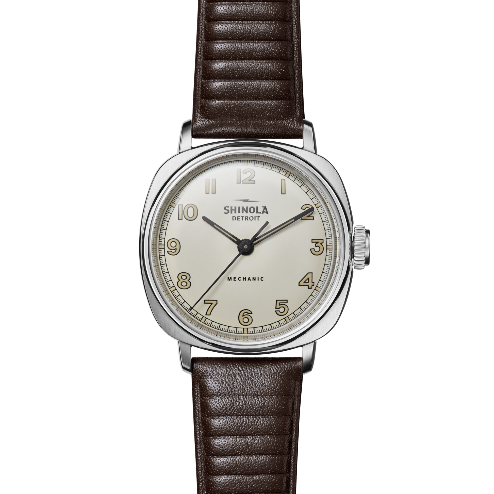 The Shinola Mechanic Watch - Alabaster features a round cream dial, gold Arabic numerals, silver case, and brown leather strap, displayed against a white background.