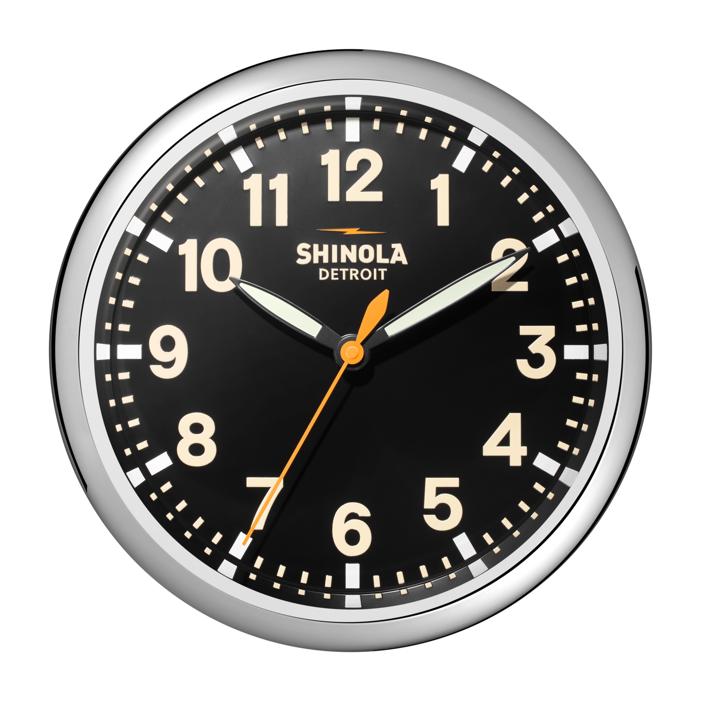 A Shinola 14" Runwell Clock - Black features a black face, white numbers, chrome casing, white hour and minute hands, an orange second hand, and "Shinola Detroit" below the 12. The time shown is 10:09:33.