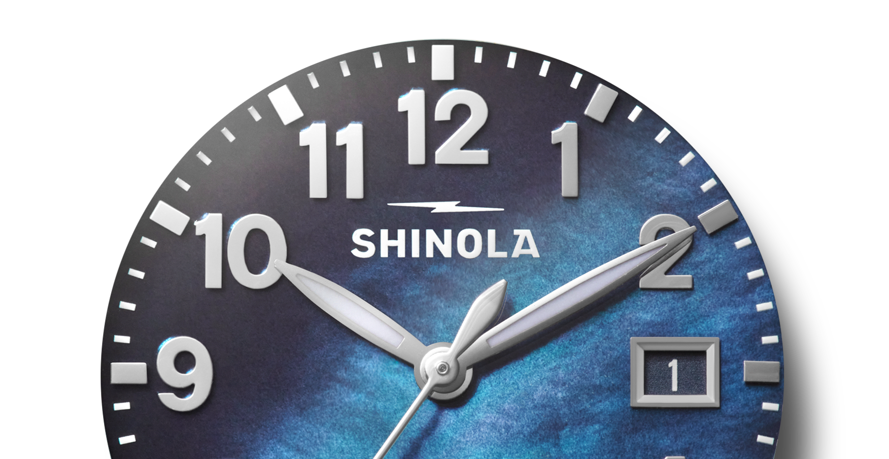 Close-up of the Shinola Runwell Watch - Cadet Blue, featuring silver hands, white hour markers, a cadet blue mother of pearl dial, and a date window at the 3 o'clock position displaying the number 1.