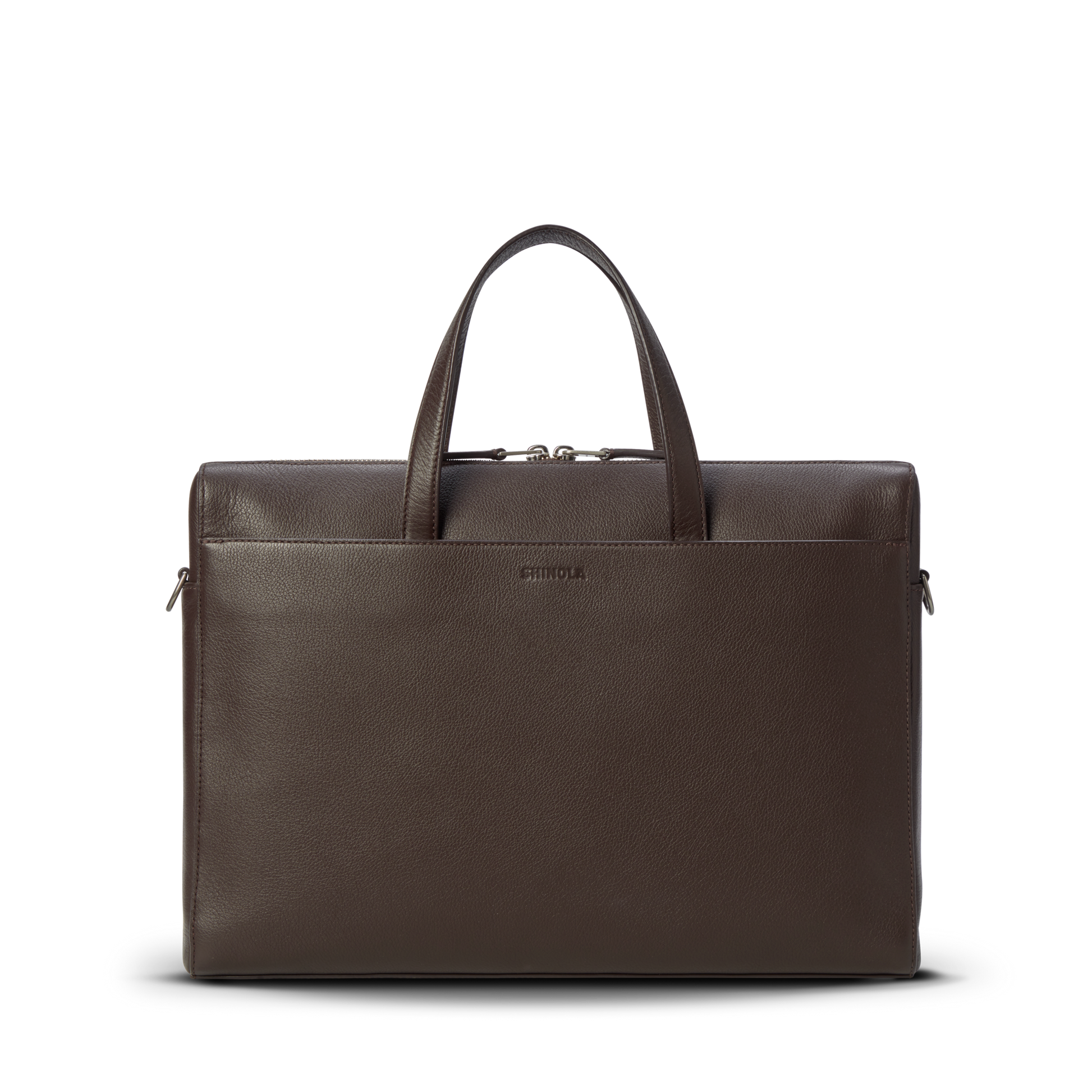 The Shinola Canfield Briefcase - Espresso is a dark brown pebbled leather bag with two handles, front pocket, zippered top, and a laptop pocket, shown against a plain white background.