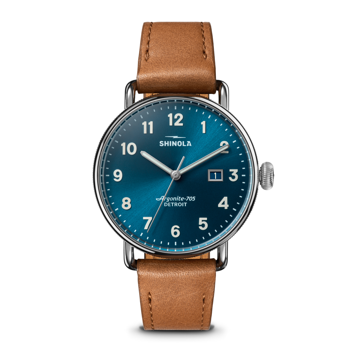 The Shinola Canfield Watch features an astro blue dial with white numerals, a date display, a stainless steel case, and a tan leather strap, shown against a white background.