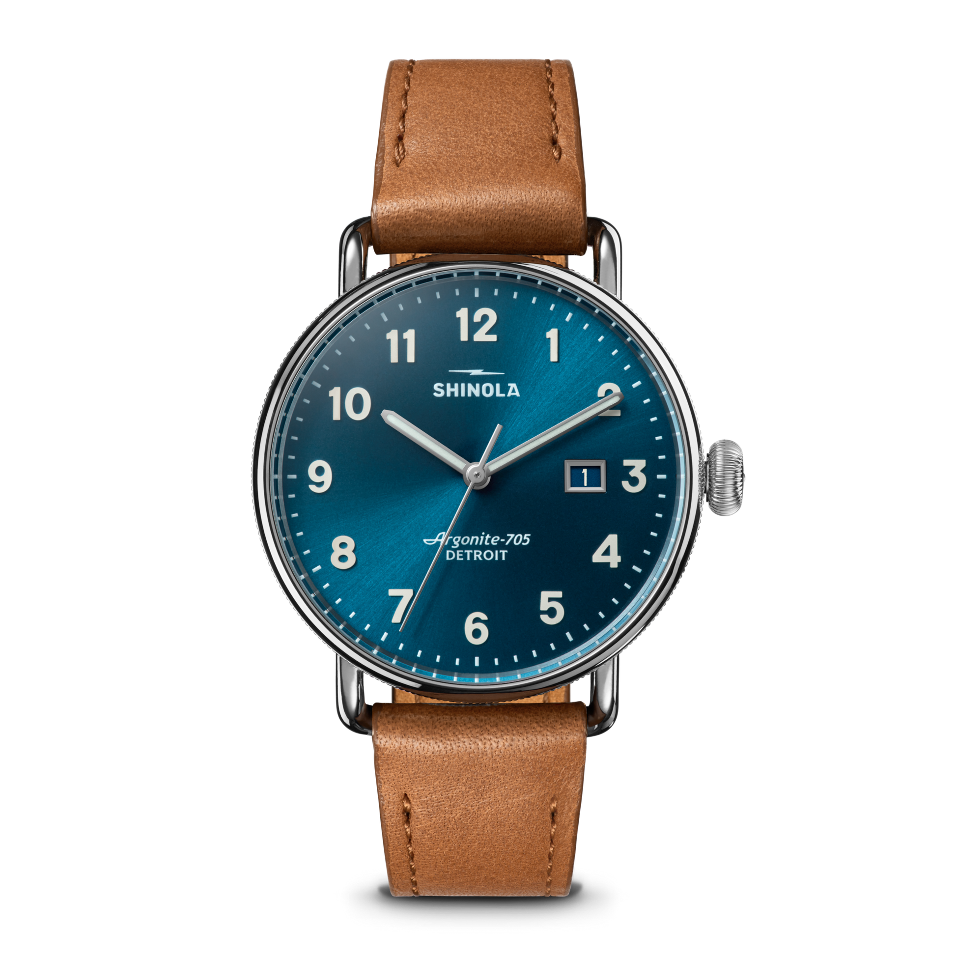 The Shinola Canfield Watch features an astro blue dial with white numerals, a date display, a stainless steel case, and a tan leather strap, shown against a white background.