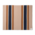 The Shinola Alpaca Throw Blanket in pink and beige is a rectangular blanket featuring wide vertical navy and brown stripes, bordered by thin light brown stripes, with a small white label sewn in one corner.