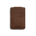A medium brown Shinola Magnetic Money Clip Card Holder with visible stitching, two credit card slots, and the brand name embossed at the bottom, shown on a white background.