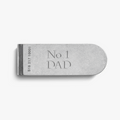 The Shinola Engravable Money Clip - Sterling Silver features "No 1 DAD" and unique serial number 518217 10001 engraved on its side, shown on a plain white background.