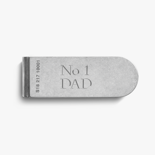 The Shinola Engravable Money Clip - Sterling Silver features "No 1 DAD" and unique serial number 518217 10001 engraved on its side, shown on a plain white background.