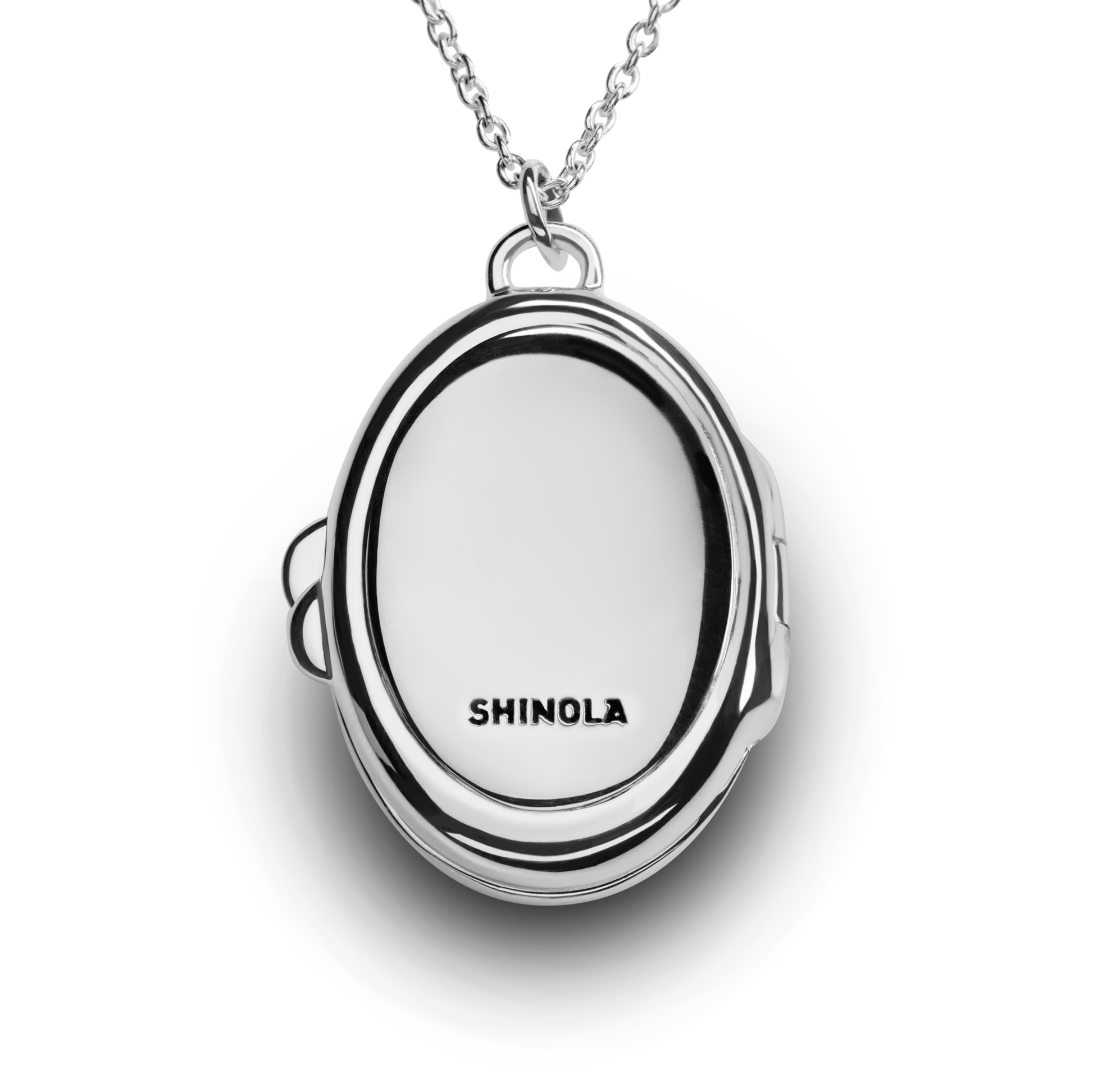 The Heirloom Statement Locket Necklace by Shinola is displayed against a white background. This sterling silver necklace features an oval, closed locket engraved with "SHINOLA" on the front.