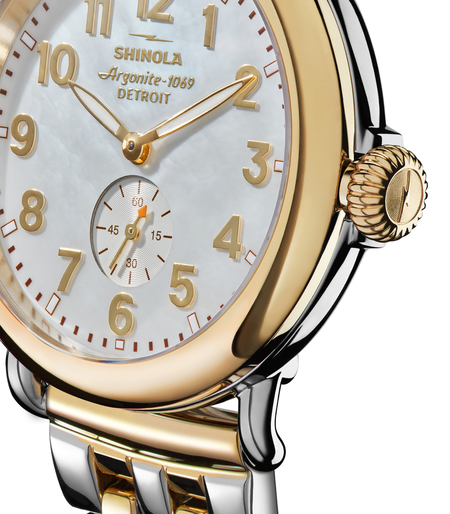 Close-up of a Shinola Runwell Watch - Mother Of Pearl with a gold and silver stainless steel bracelet, white mother-of-pearl face, gold numbers and hands, small seconds subdial above 6 o’clock, and the Shinola logo on the dial.