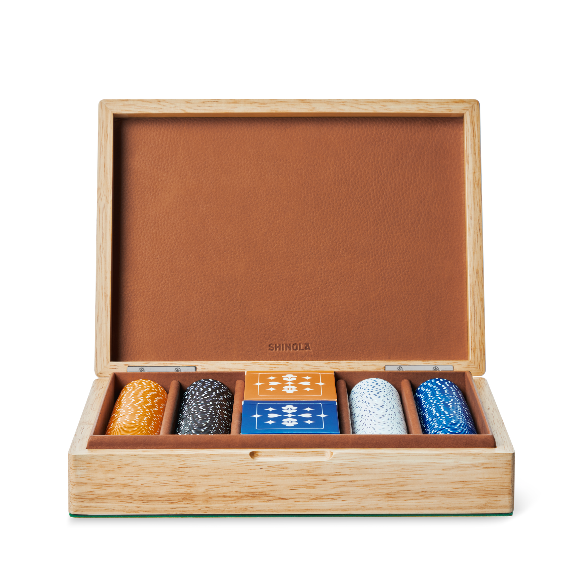 A Lacquered Wood Poker Set in Cream/Blue by Shinola is displayed open, revealing custom orange, black, white, and blue poker chips and two blue playing card decks in a refined leather-lined case.