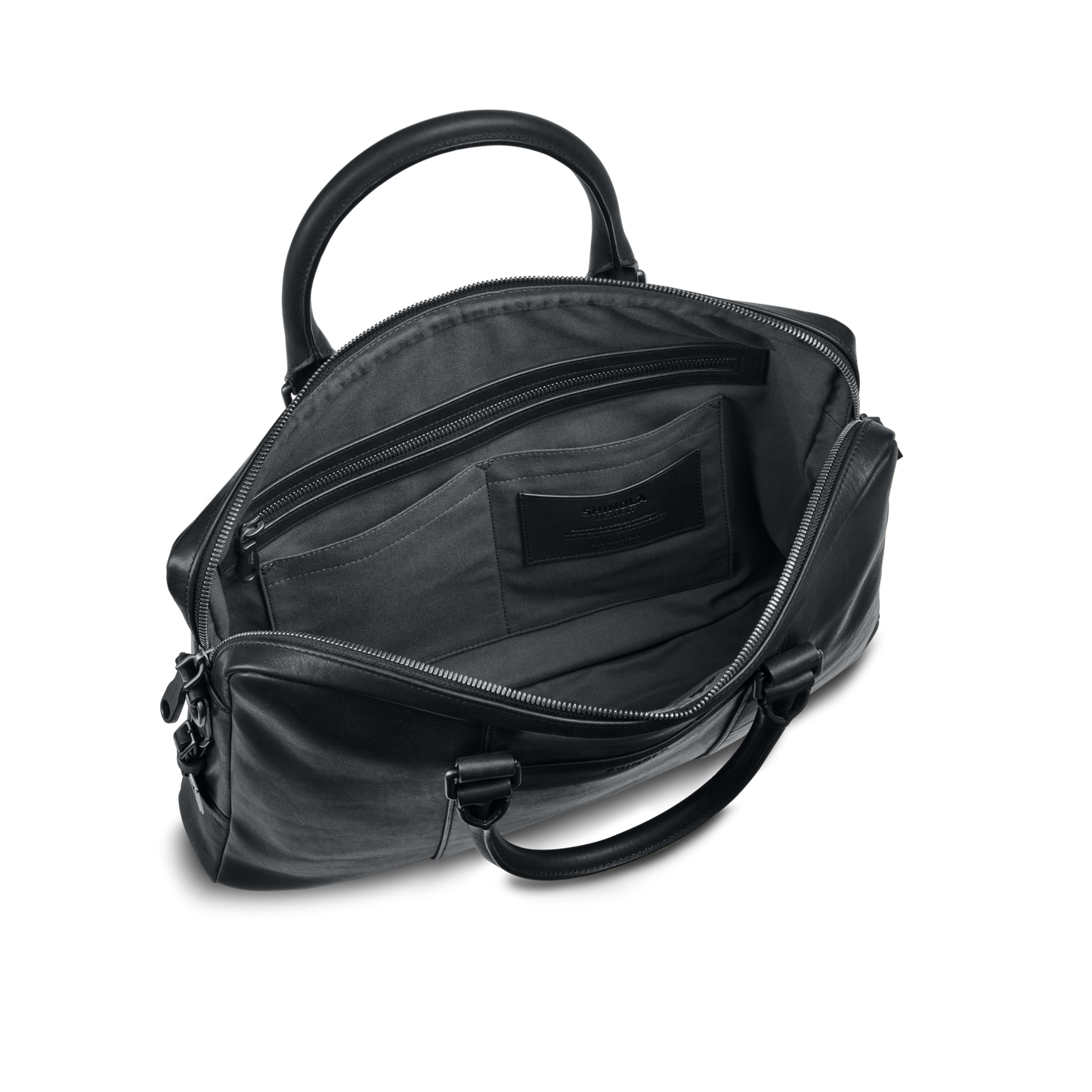 The shinola.momputer Briefcase - Black features two handles and a spacious interior with zippered and slip pockets, making it a stylish work bag. Shown open against a plain white background.