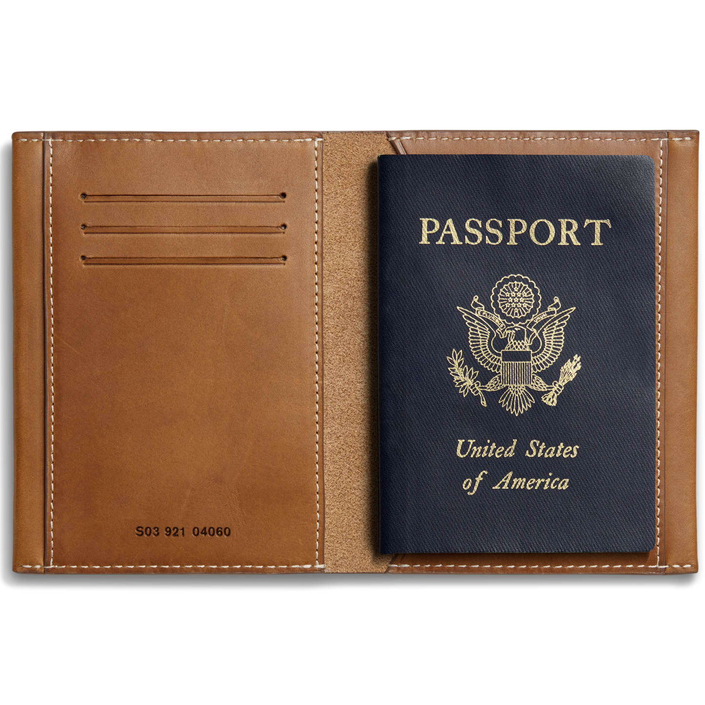 The Shinola Passport Holder - Tan is a stylish Italian leather travel accessory featuring card slots on the left and space for your U.S. passport on the right, with a classic design perfect for organizing essentials.