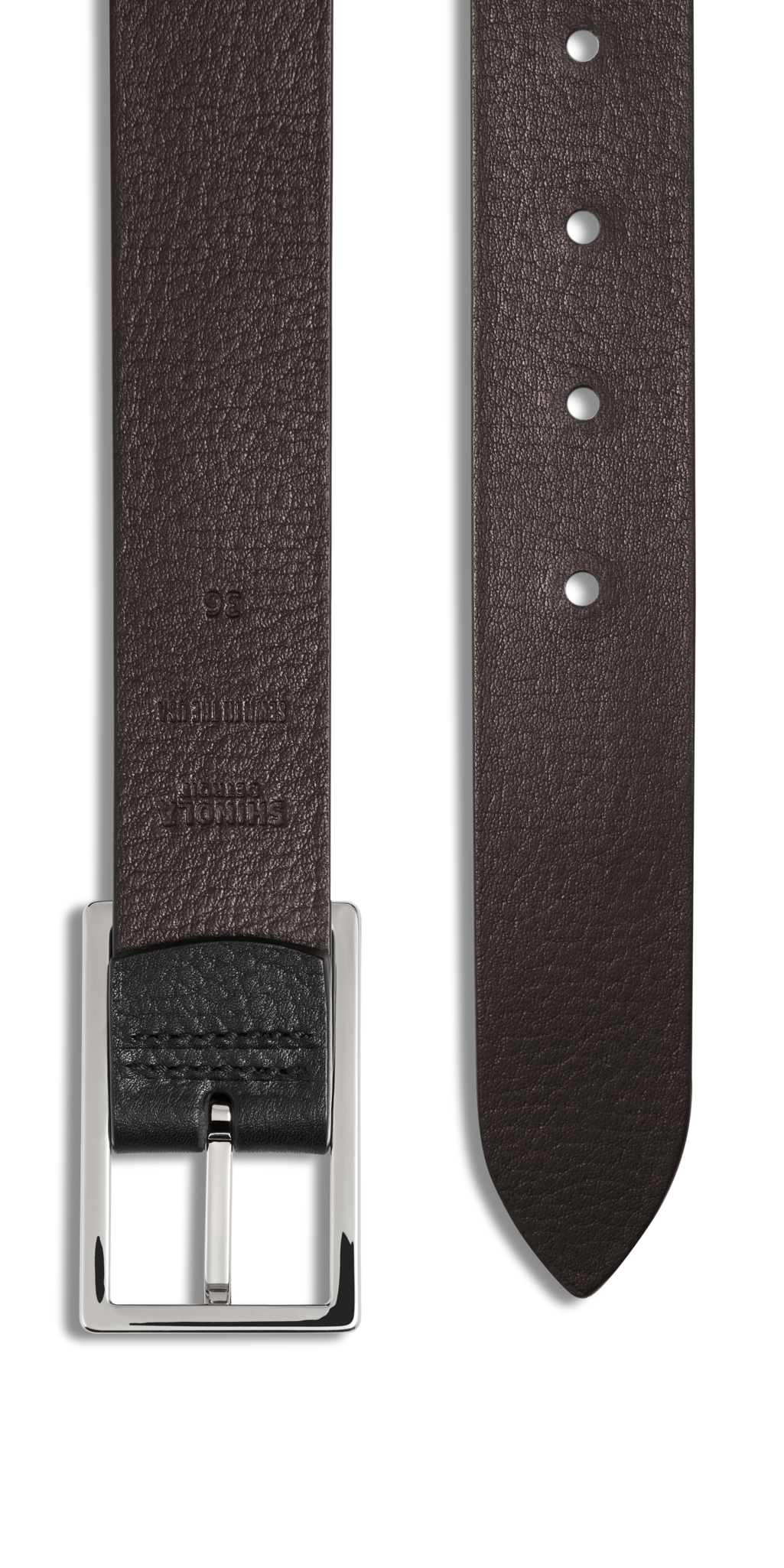 Close-up of the Shinola 1 1/4" Reversible Rectangle Buckle Belt in black, featuring textured bridle leather, multiple adjustment holes, and a silver rectangular buckle—an ideal classic accessory shown flat on a white background.