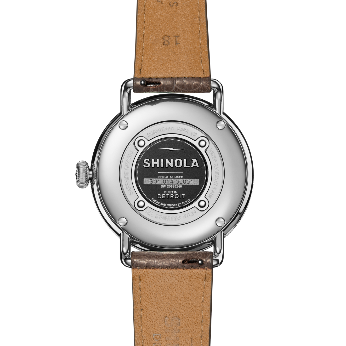 The Canfield Watch by Shinola features a 38mm metal case with logo, serial number, and "Built in Detroit" text on the back. The gray brown American alligator leather strap highlights detailed stitching for a luxurious look.