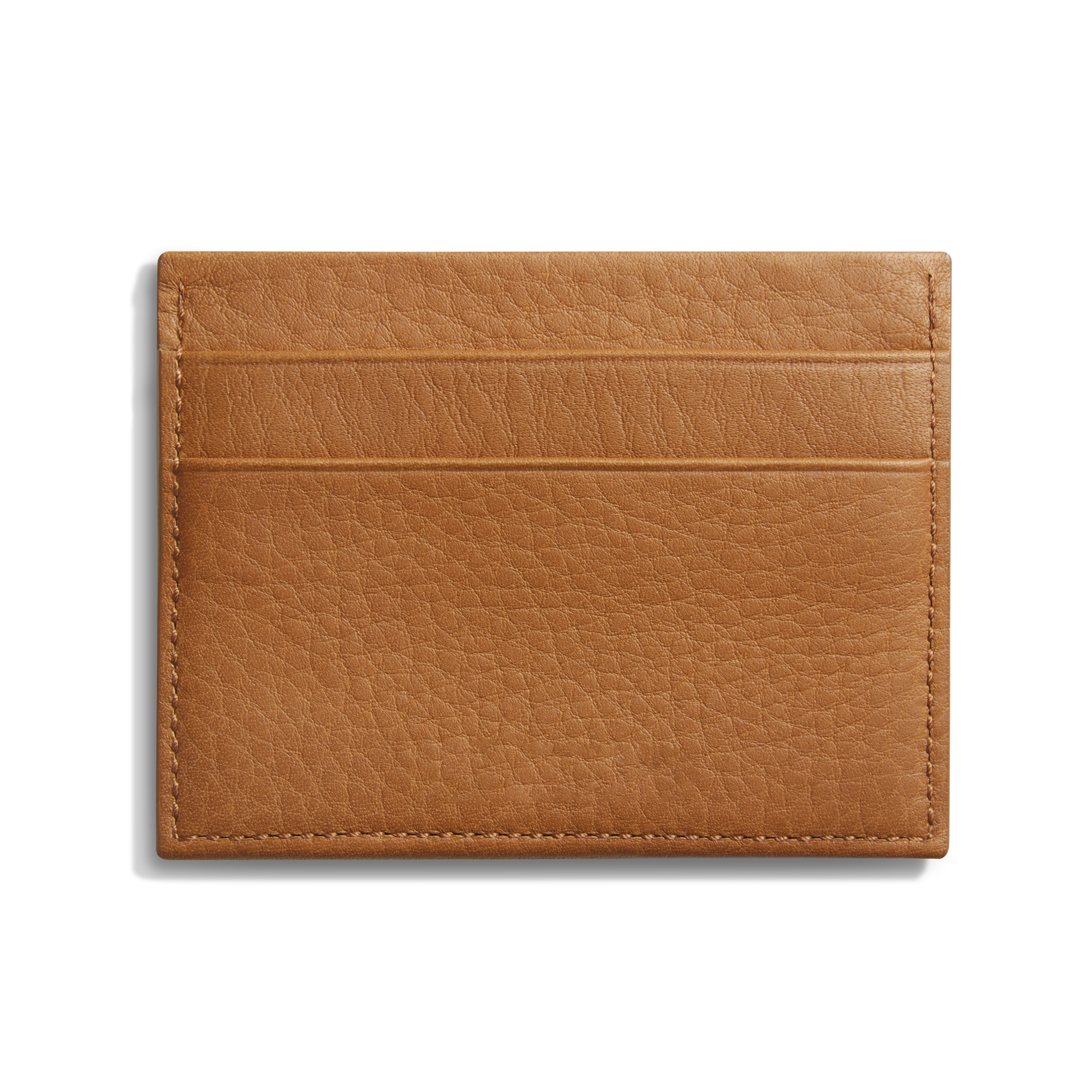 The Shinola 5 Pocket Card Holder in tan leather offers a pebbled finish, two horizontal card slots on one side, and a slim design—ideal as a daily wallet for carrying essentials. Shown against a plain white background.