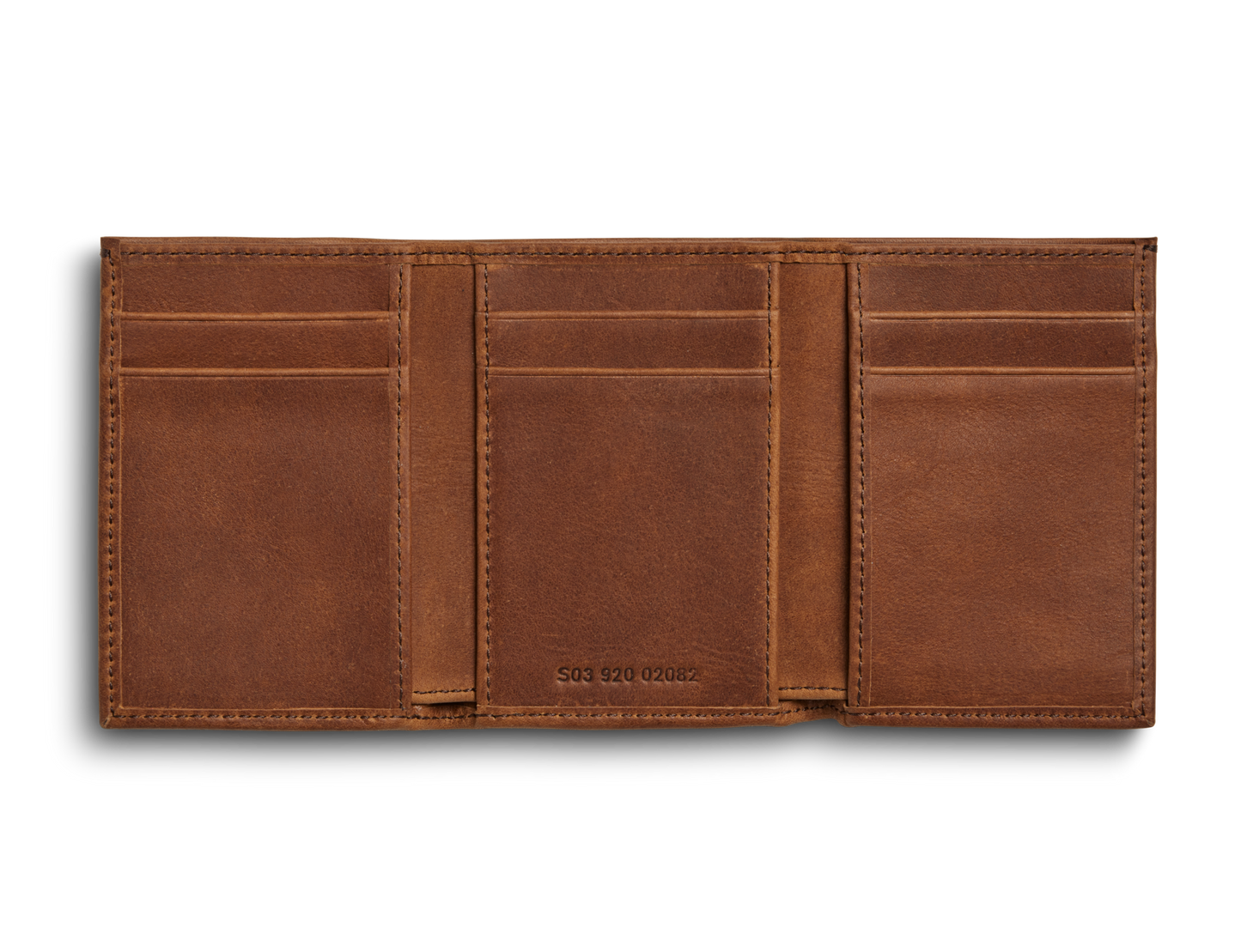 The Shinola Trifold Wallet - Medium Brown is open on a white background, showing multiple card slots and compartments. It features RFID protection for added security.