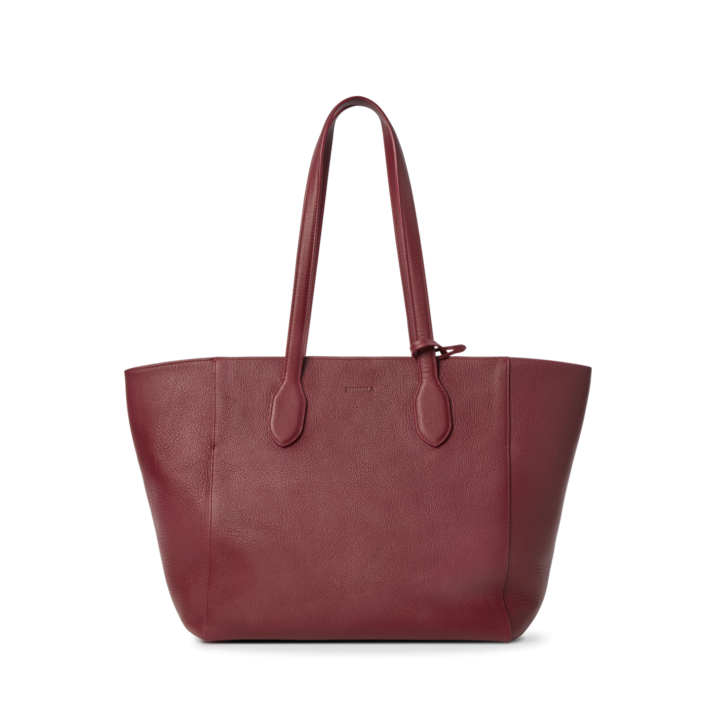The Shinola Runabout Tote Bag - Ruby is a large, deep red pebbled leather tote with two long handles, a textured surface, and minimalistic design. Lightweight and practical, it includes an interior zipper pouch. Shown on a plain white background.