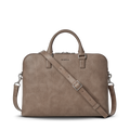 The Shinola Portfolio Briefcase - Stone is shown on a white background. Made of taupe leather, it features two top handles, a detachable adjustable shoulder strap, zipper closure, and an embossed Shinola logo above the zipper.