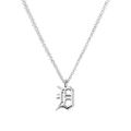 The Shinola Detroit "D" Charm Necklace in sterling silver features a thin chain and an ornate gothic "D" pendant, elegantly displayed against a white background—a stylish nod to classic Detroit jewelry.