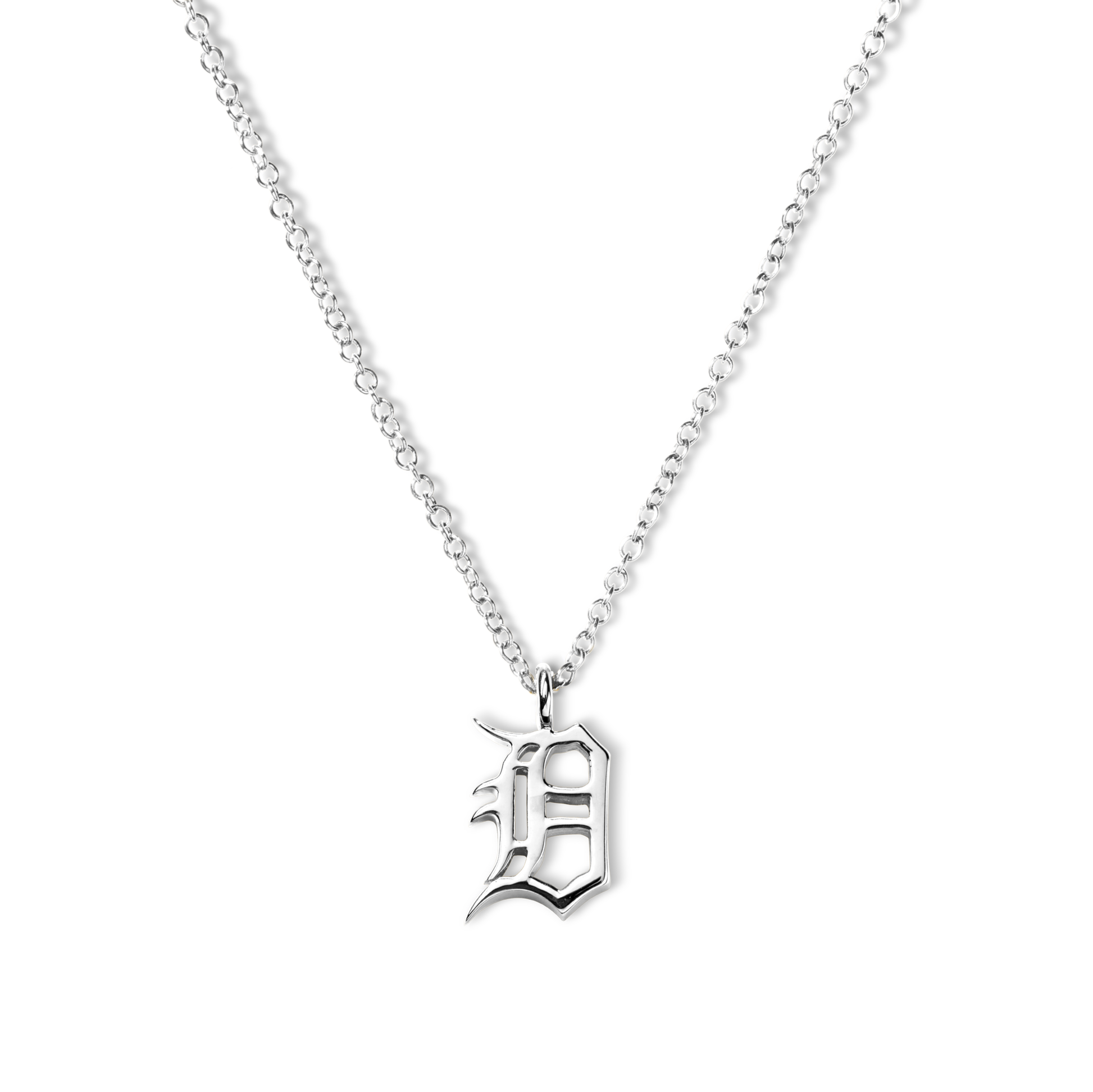 The Shinola Detroit "D" Charm Necklace in sterling silver features a thin chain and an ornate gothic "D" pendant, elegantly displayed against a white background—a stylish nod to classic Detroit jewelry.
