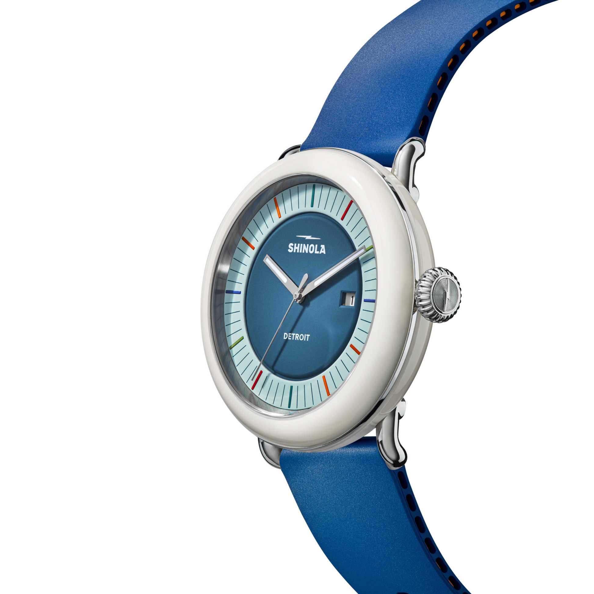 The Shinola Detrola Watch - Blue features a round blue face, white bezel, and blue leather strap with multicolored minimalist hour markers. This art-inspired wristwatch combines style and Detroit branding.