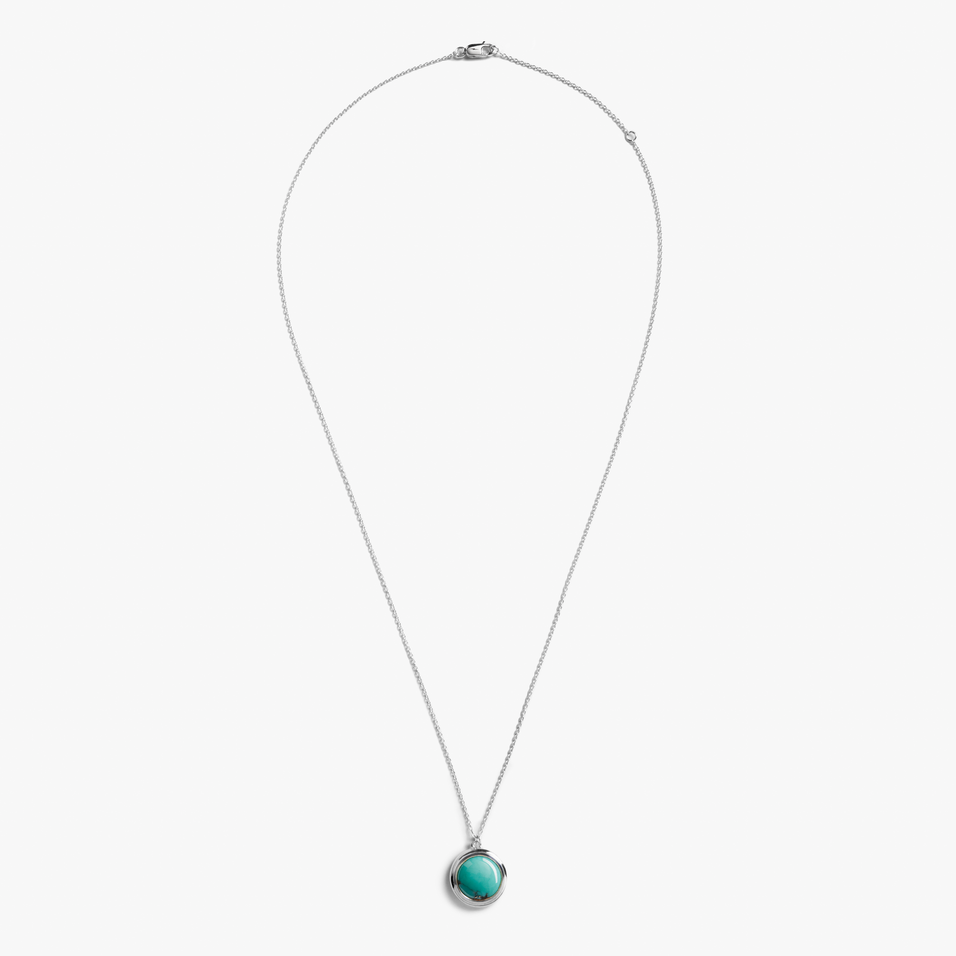 The Heirloom Turquoise Pendant Necklace by Shinola features a sterling silver thin chain and a round turquoise pendant in a simple bezel, shown on a plain white background.