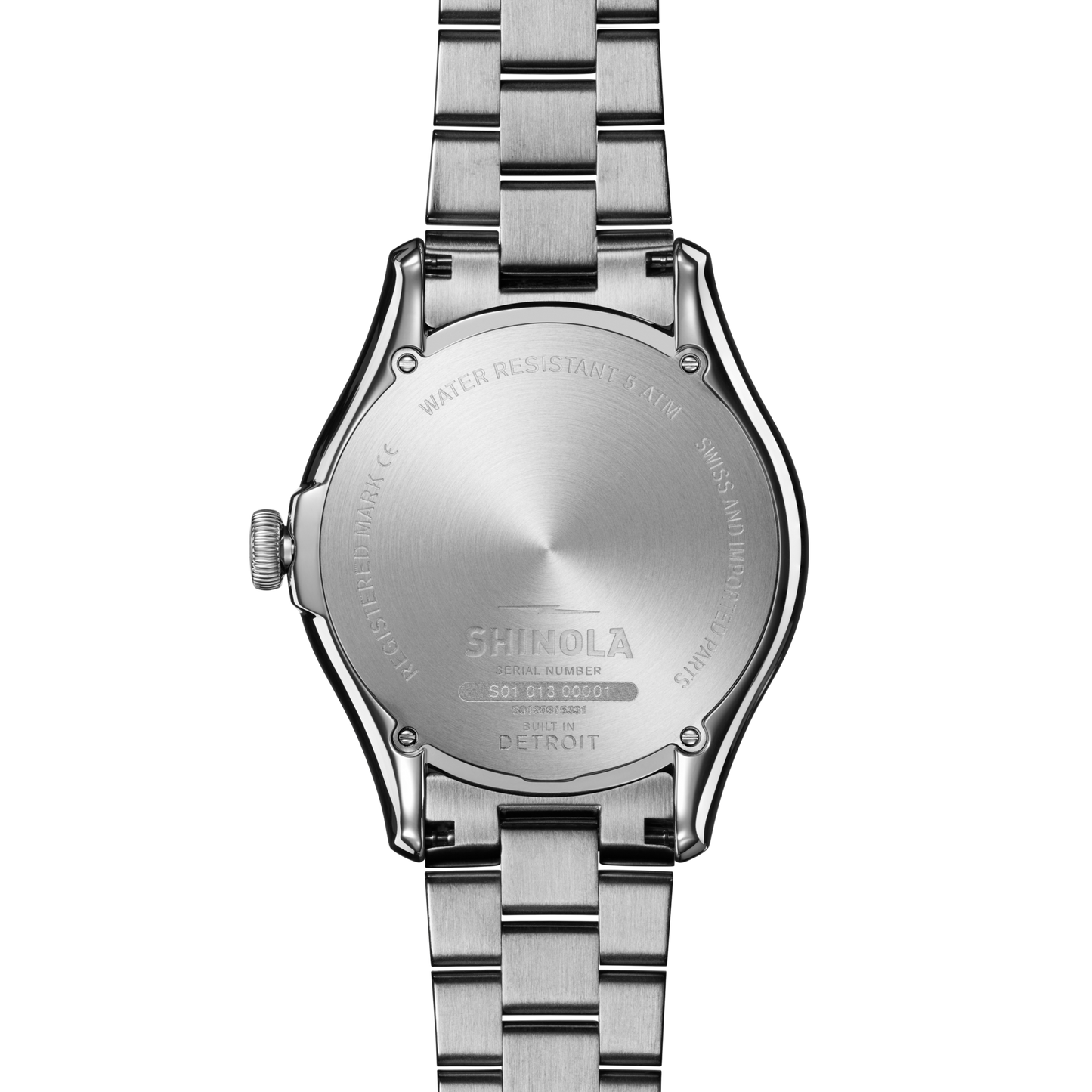 The back of the Shinola Vinton Watch - Whiskey features engraved details like water resistance, serial number, and “Built in Detroit,” and is paired with a matching stainless steel bracelet.