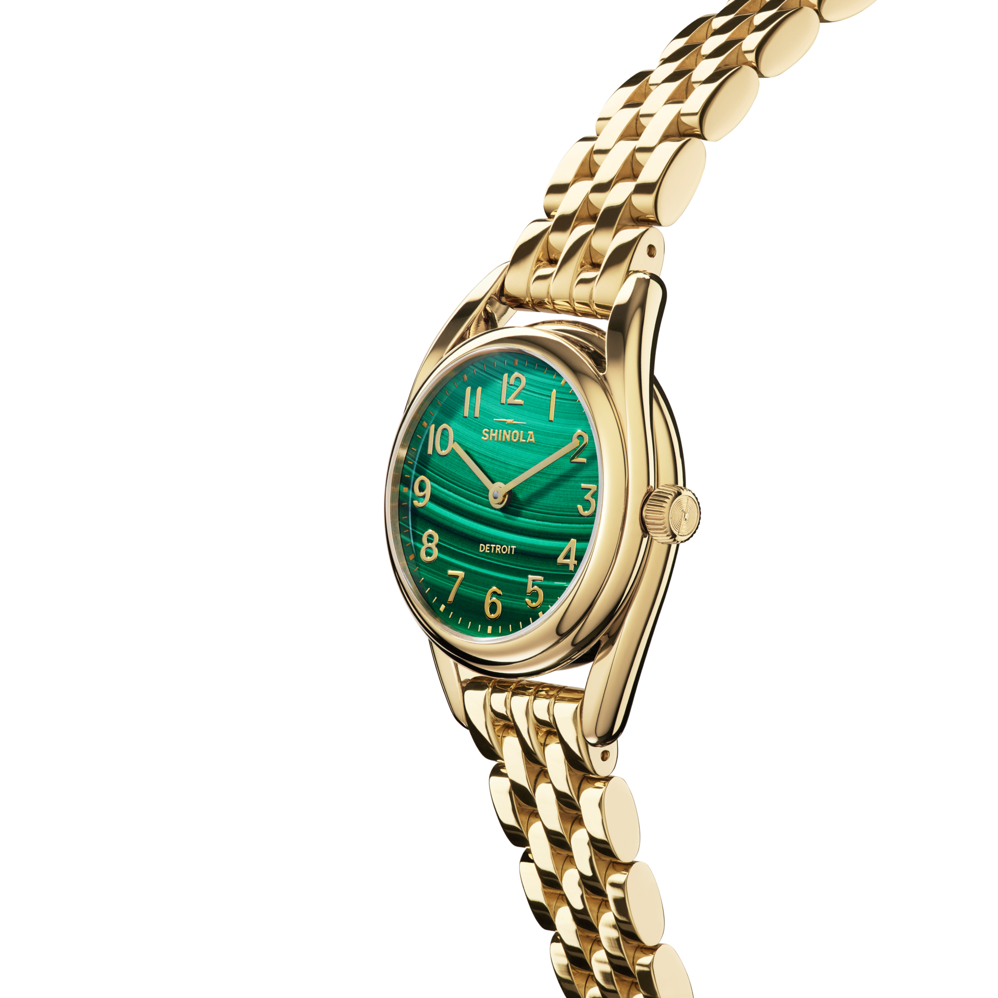 The Shinola Derby Watch - Malachite features a gold stainless steel case, metallic link band, and a green textured Malachite dial with gold numbers and hands, shown angled against a white background.