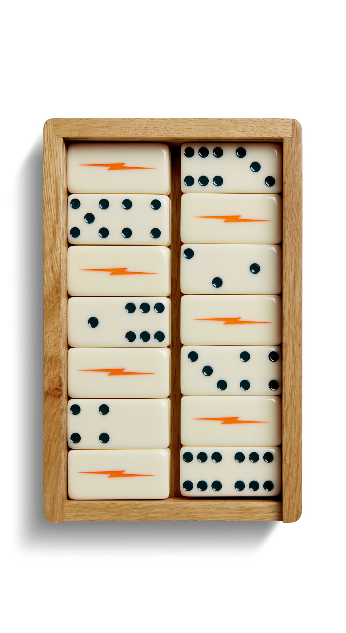 The Shinola Dominoes Set - Cream / Blue features twelve hand-painted dominoes: six with orange lightning bolts and six with black dots in different patterns, all neatly arranged in a wooden box.