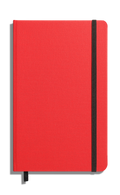 The Shinola Medium Hard Ruled Journal in Tomato features a closed red linen cover with a black elastic band on the right edge and a black ribbon bookmark, shown on a white background.